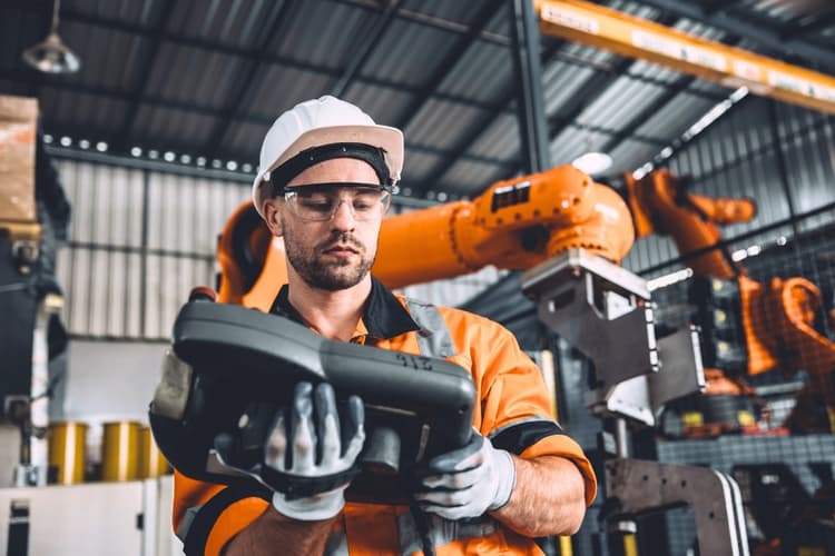 Team of technicians repairing industrial spare parts